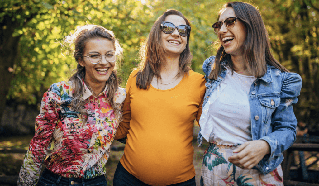 Pregnant woman with friends