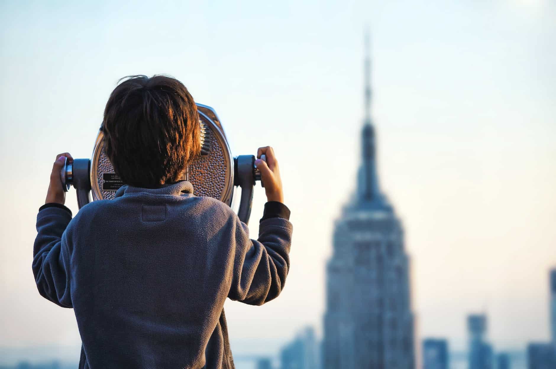 boy looking at the empire state building