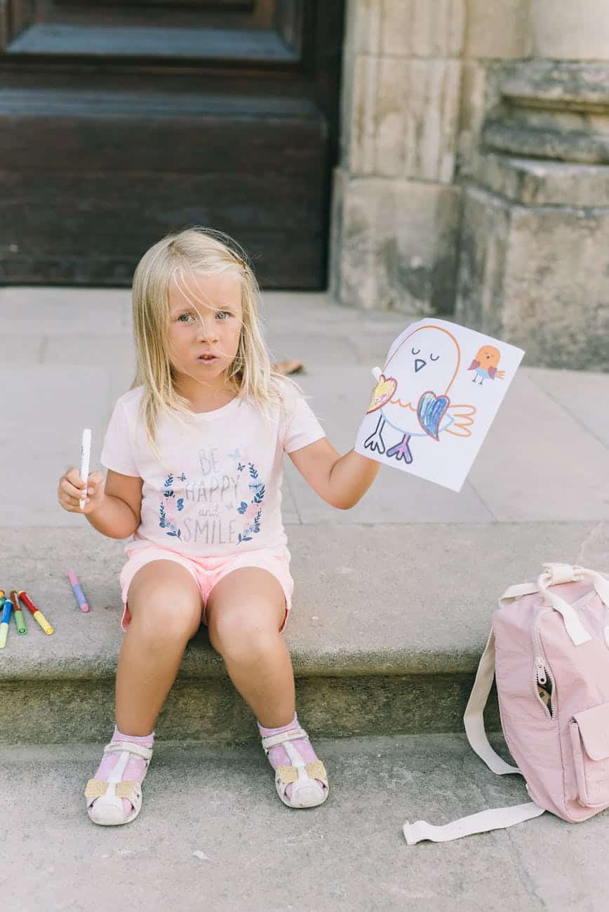 girl showing her drawing