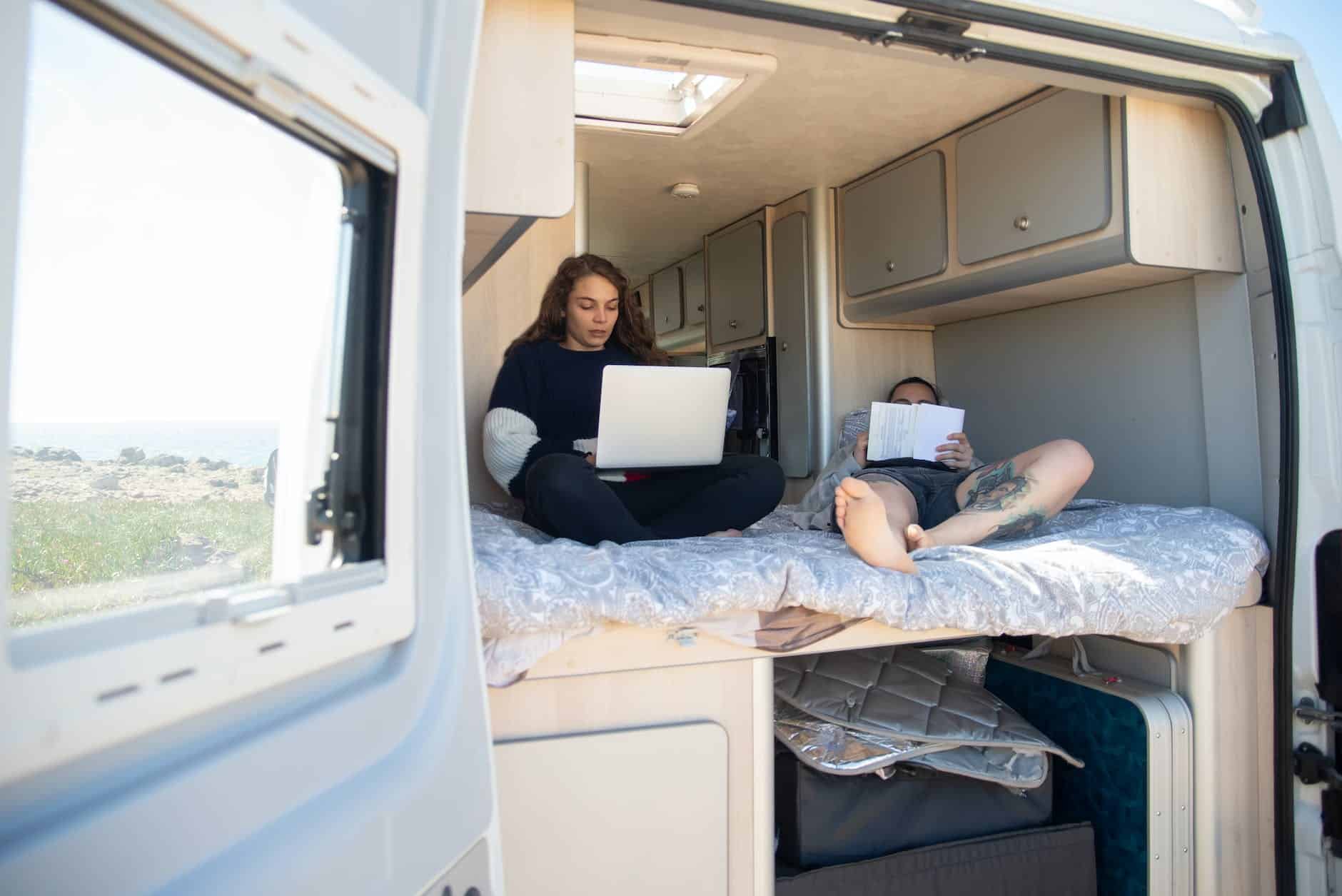 a couple sitting together in an rv