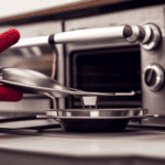An image showcasing a pair of hands wearing oven mitts, delicately turning the temperature dial on a sleek Greystone camper oven, while the soft glow of the oven's interior illuminates the surrounding kitchenette